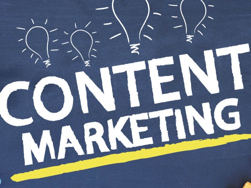 Messy desk with the words "content marketing" written on it.