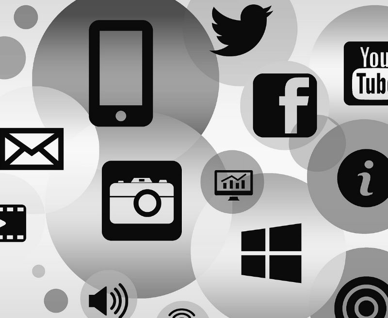 Social media icons|Hand holding smart phone|Young woman on smart phone