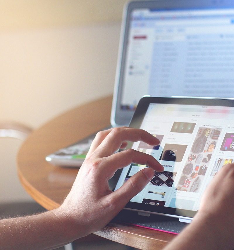 A picture of a person searching using an ipad