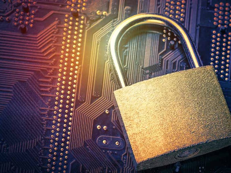 Padlock on computer motherboard|Close up of hands typing code into a laptop|password being entered on a computer screen|person viewing captcha image on their phone