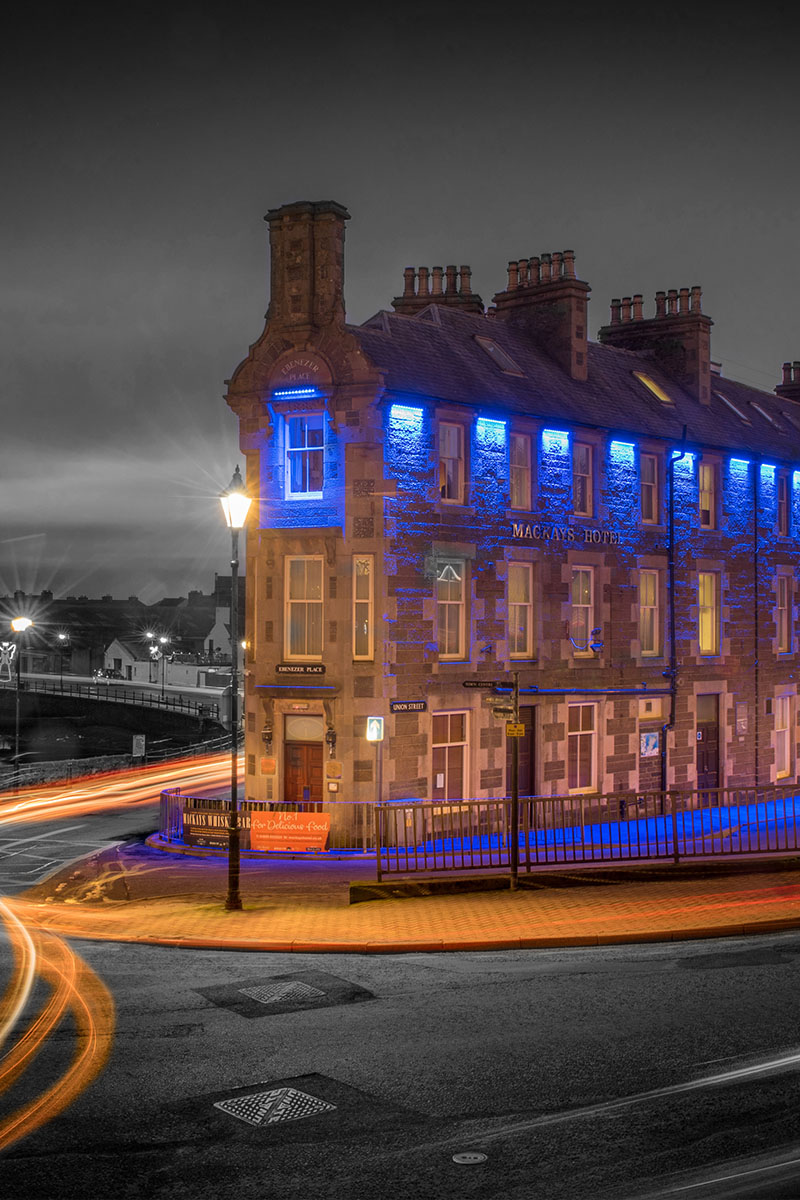 The exterior of Mackays Hotel in Wick lit up at night