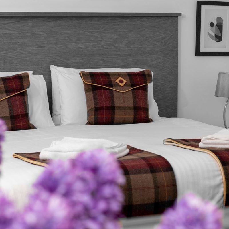 A bedroom at Elderburn Luxury Lodges
